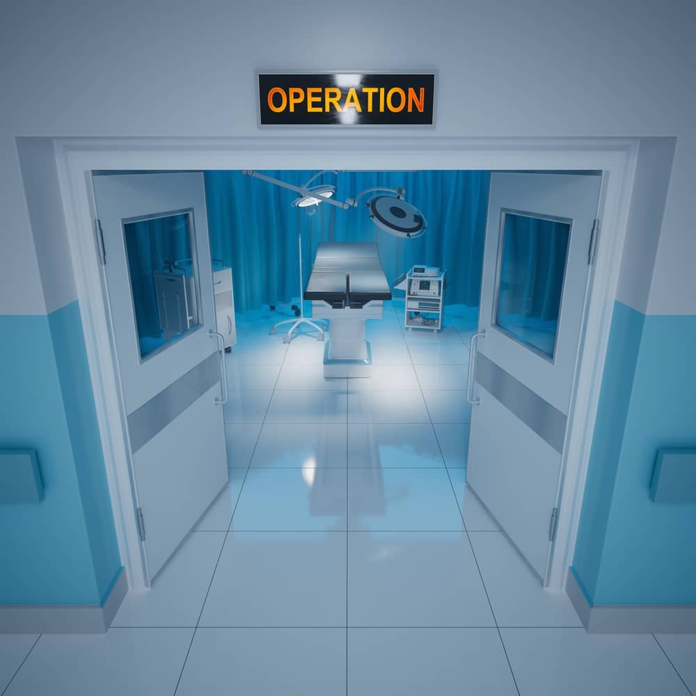 Modern operating room with pristine surgical suite, featuring an empty operating table under bright surgical lights, with the illuminated 'OPERATION' sign above the entrance, symbolizing controlled, elite surgical environment