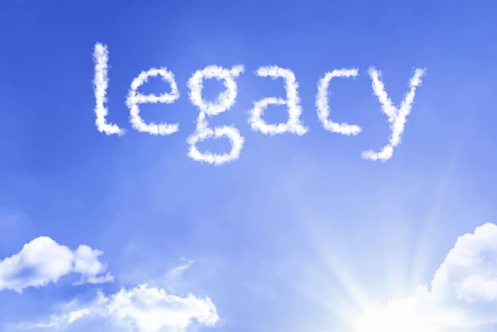 Word legacy formed in white clouds against blue sky representing lasting impact of compassionate plastic surgery practice