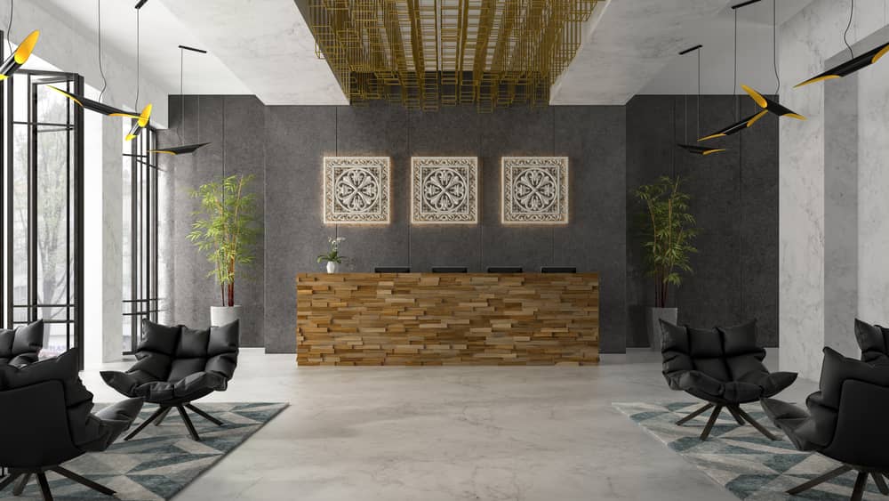 Luxury med spa reception area with wood reception desk, modern black chairs, and decorative wall art