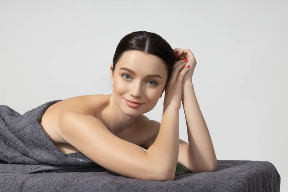 Young woman with glowing skin representing Gen Z aesthetic client for prejuvenation treatments at med spa